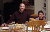 Robert Stanek at home with his son